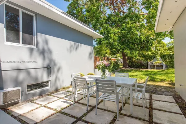 a view of backyard with seating space