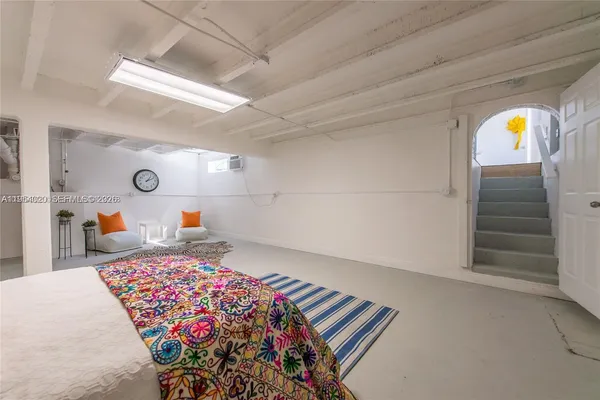 a bedroom with bed and window