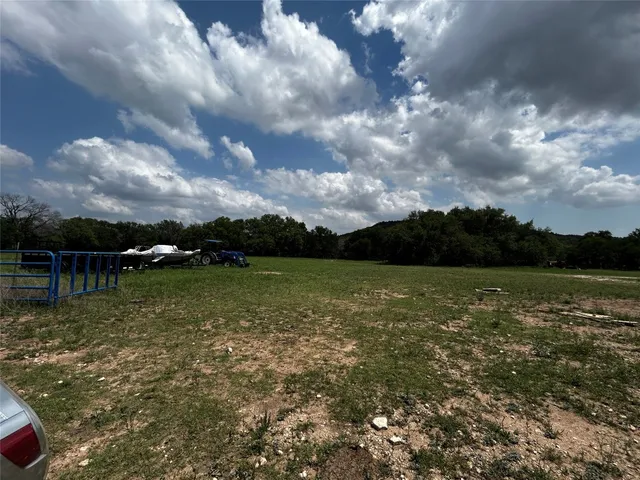 a view of lake with green space