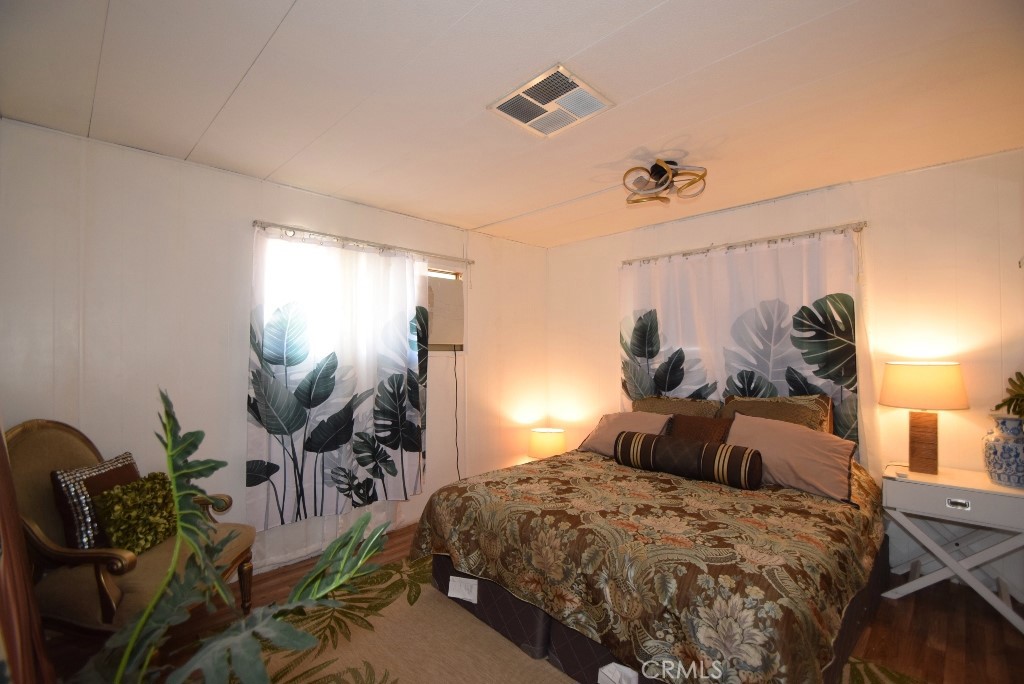 7425 Church Street, Unit 10 Yucca Valley, CA 92284 - Photo 14 of 24 a bedroom with bed and window