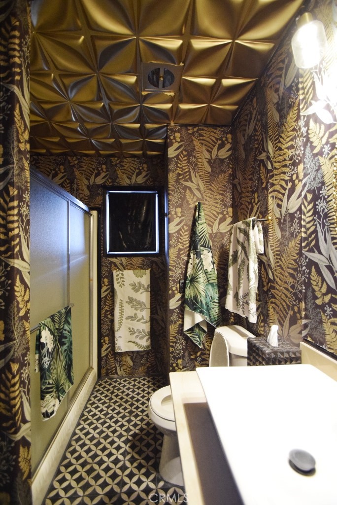 7425 Church Street, Unit 10 Yucca Valley, CA 92284 - Photo 22 of 24 a bathroom with a sink toilet and shower