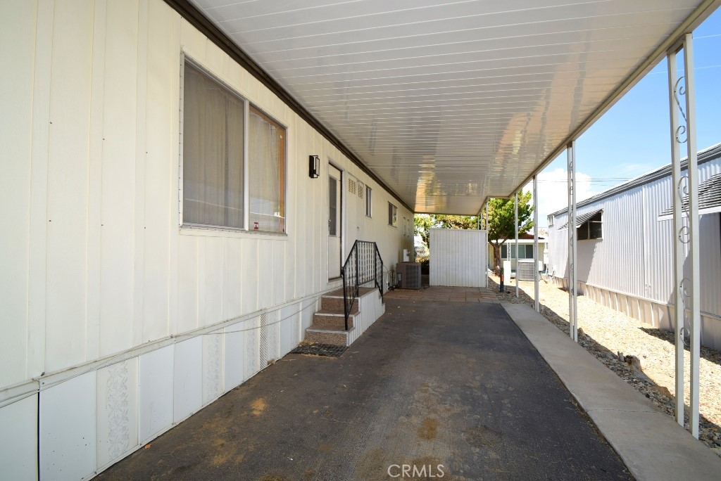 7425 Church Street, Unit 10 Yucca Valley, CA 92284 - Photo 24 of 24 a view of a hallway with staircase
