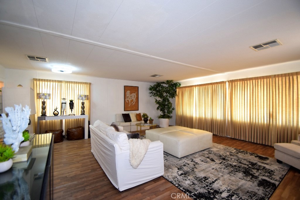 7425 Church Street, Unit 10 Yucca Valley, CA 92284 - Photo 5 of 24 a living room with furniture and a rug