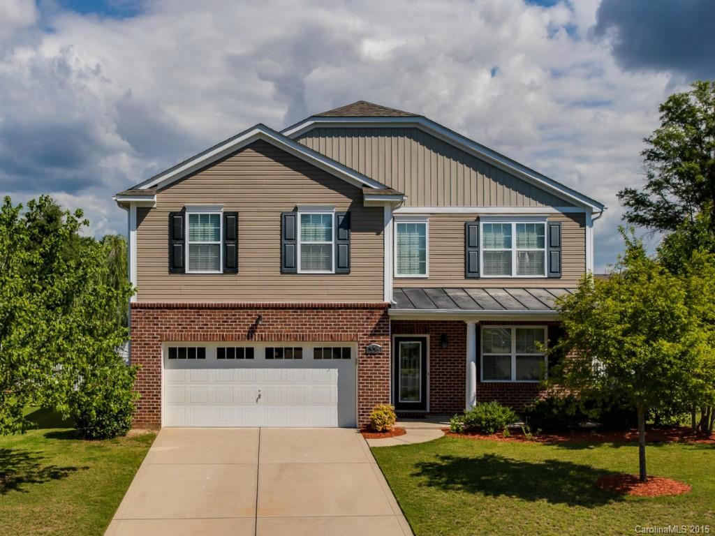 306 Allspice Road Fort Mill, SC 29708 - Photo 1 of 24 a front view of a house with a yard and trees