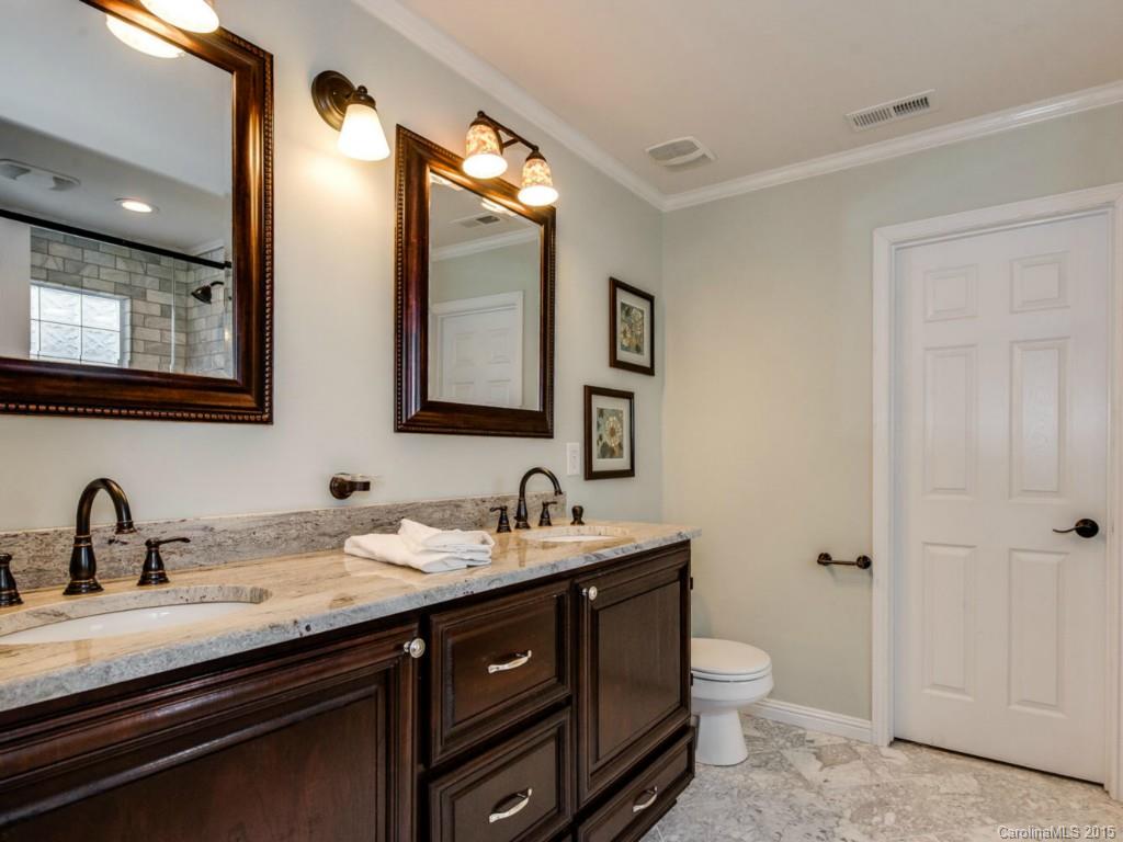 306 Allspice Road Fort Mill, SC 29708 - Photo 19 of 24 a bathroom with a double vanity sink toilet and mirror
