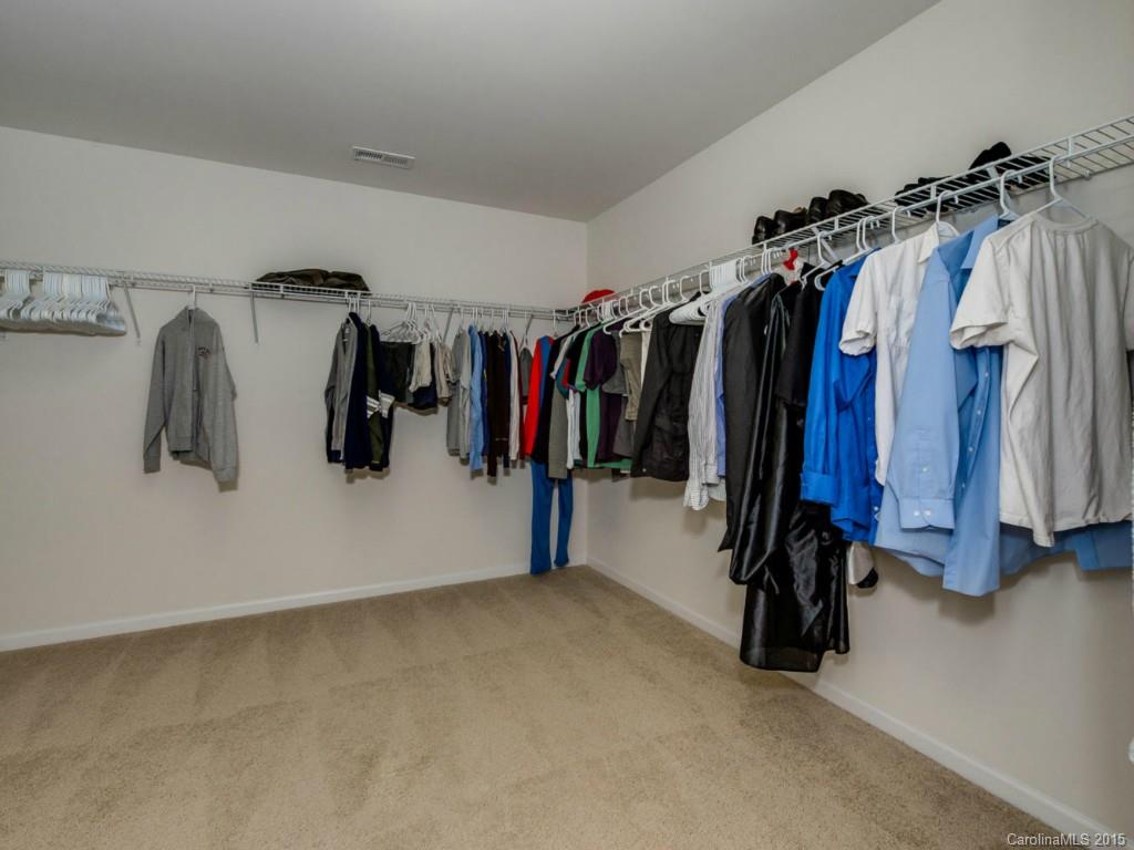 306 Allspice Road Fort Mill, SC 29708 - Photo 9 of 24 a view of walk in closet with clothes and shoes