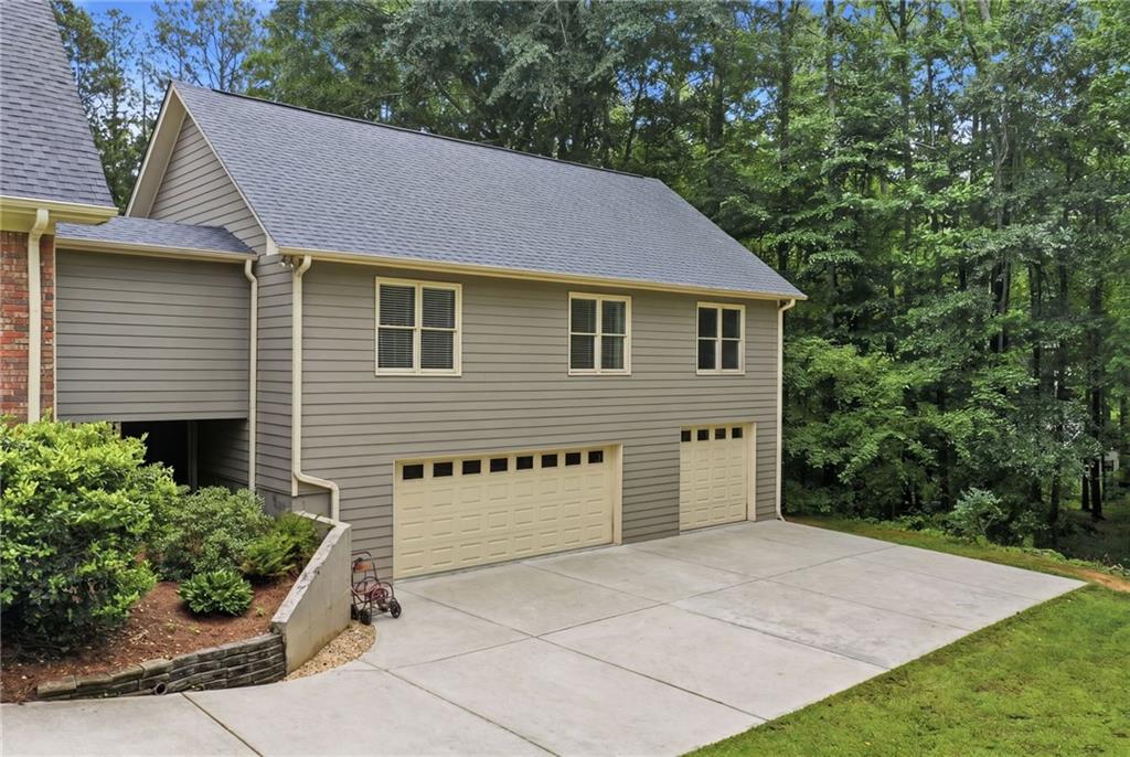 4891 Bill Cheek Road Auburn, GA 30011 - Photo 70 of 99 a view of a house with a yard