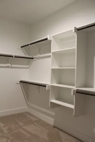 a view of an empty walk in closet