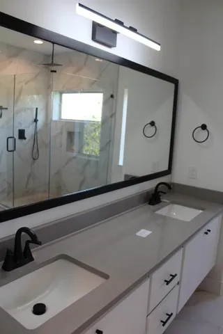 a bathroom with a sink and a mirror