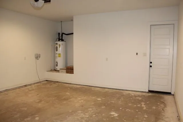 an empty room with a empty space and windows