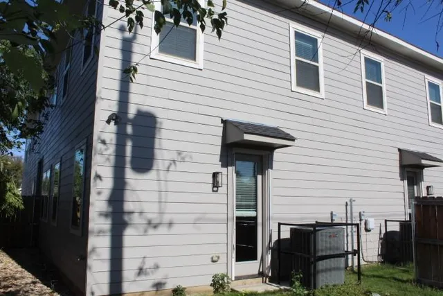 a front view of a house with a table and chairs