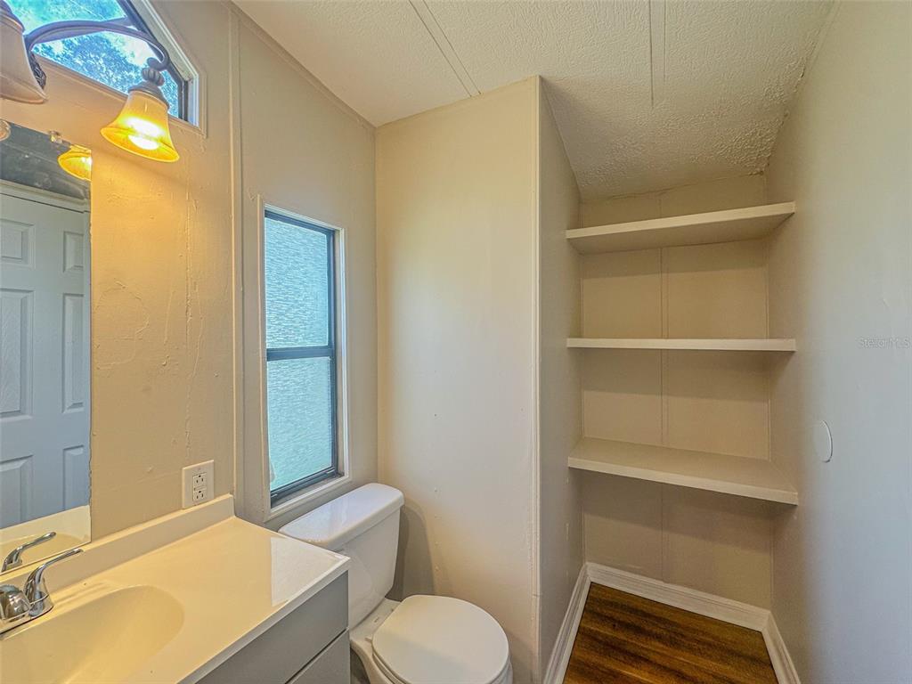 2218 Ellie Road, Unit 1 Auburndale, FL 33823 - Photo 12 of 21 a bathroom with a sink toilet and shower