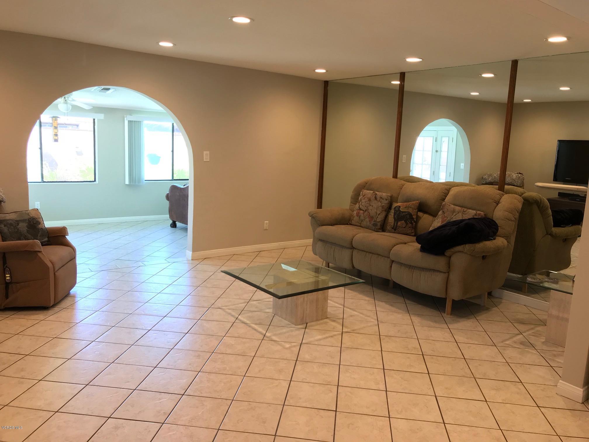 2227 Ralston Street Simi Valley, CA 93063 - Photo 3 of 35 a living room with furniture and a chandelier