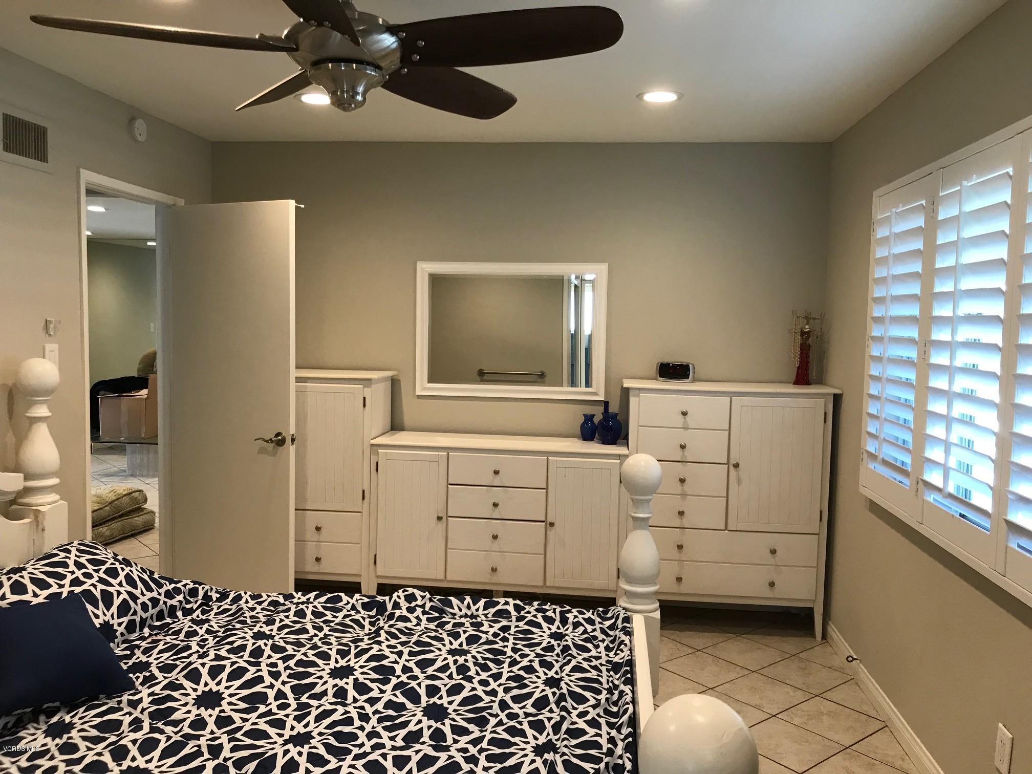 2227 Ralston Street Simi Valley, CA 93063 - Photo 21 of 35 a room with a baby crib and dresser