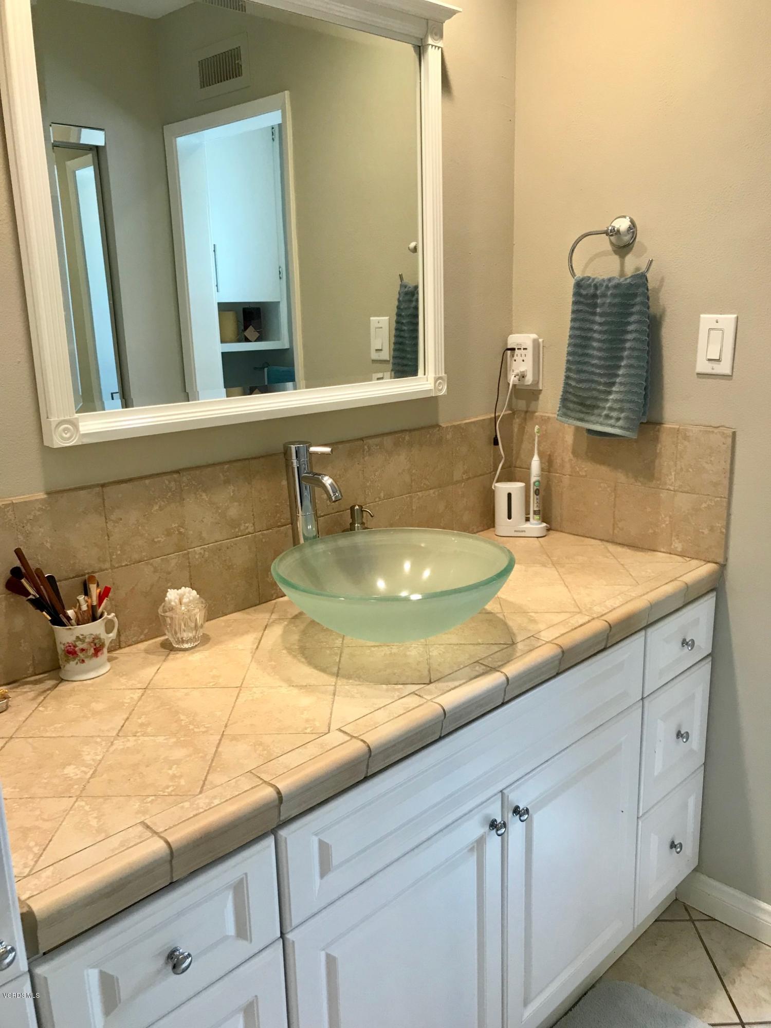 2227 Ralston Street Simi Valley, CA 93063 - Photo 22 of 35 a bathroom with sink and mirror