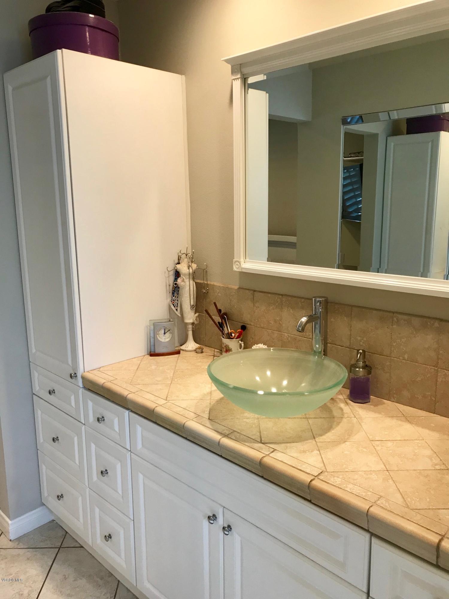 2227 Ralston Street Simi Valley, CA 93063 - Photo 24 of 35 a bathroom with a sink and a mirror