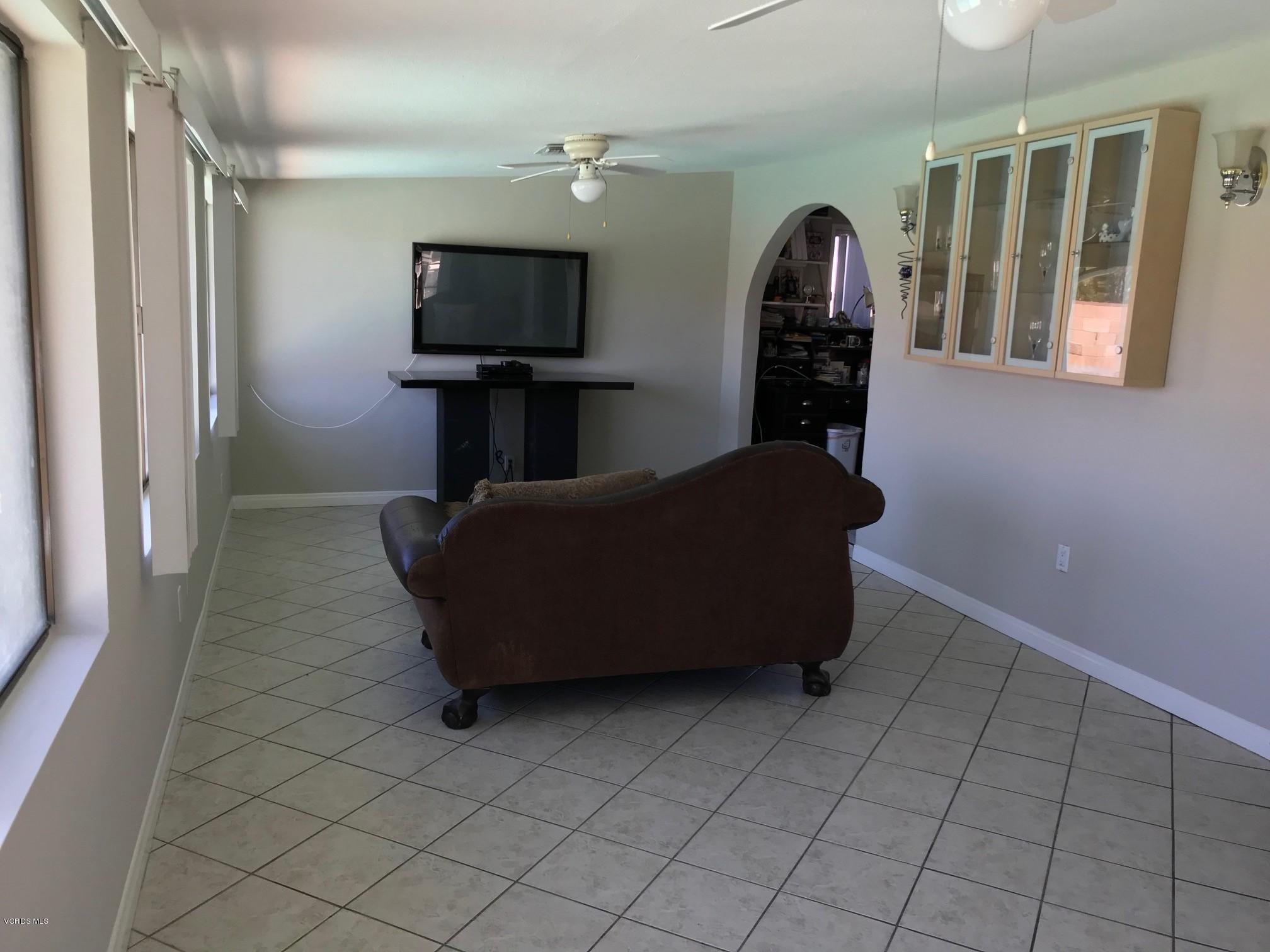 2227 Ralston Street Simi Valley, CA 93063 - Photo 28 of 35 a living room with furniture and a flat screen tv