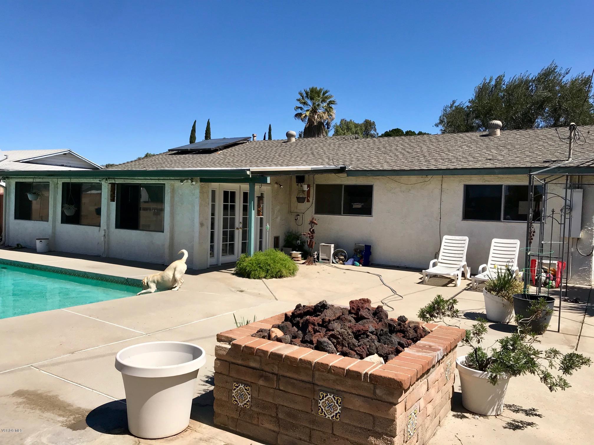 2227 Ralston Street Simi Valley, CA 93063 - Photo 35 of 35 a view of a patio with couches chairs and potted plants