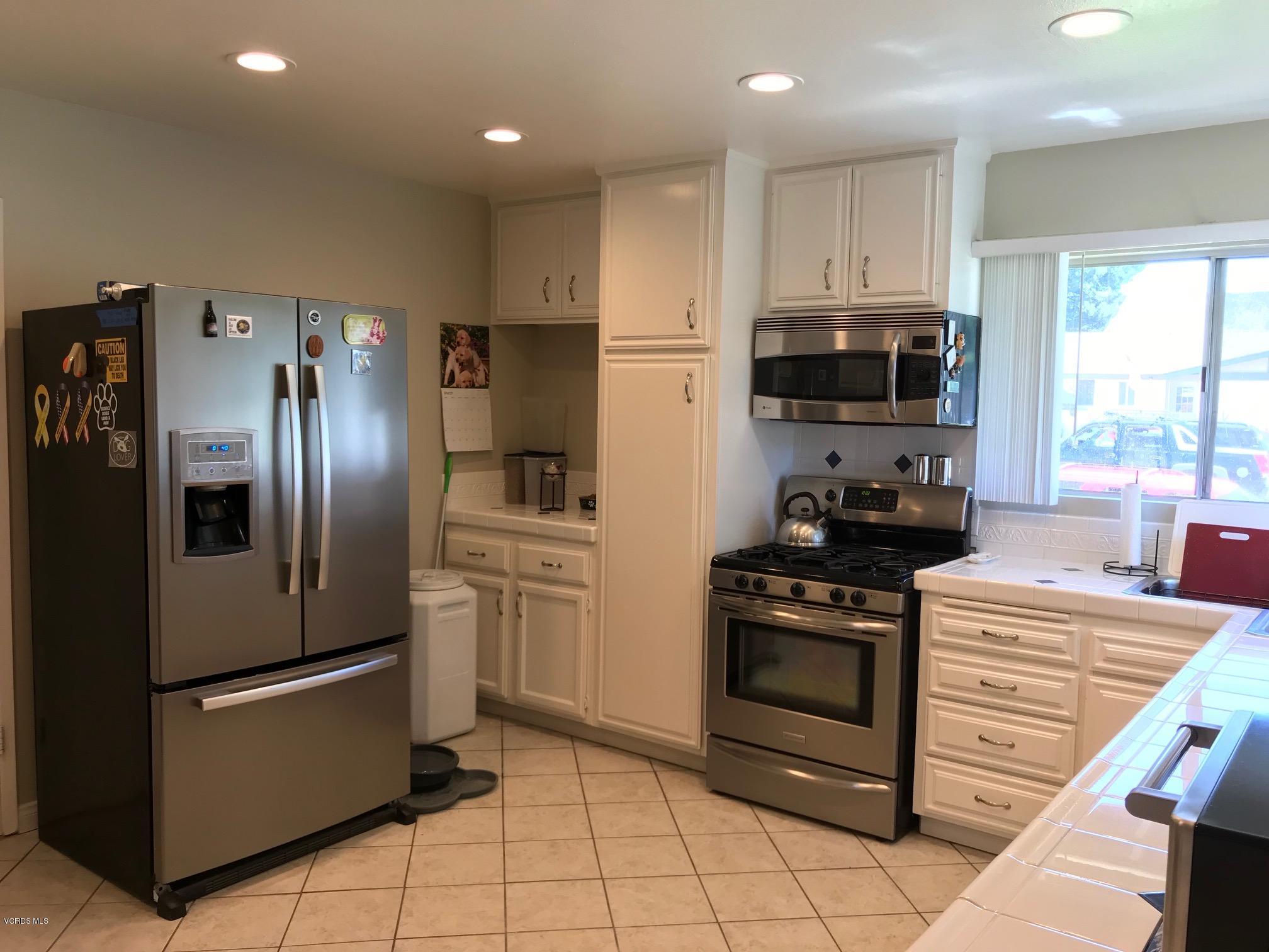 2227 Ralston Street Simi Valley, CA 93063 - Photo 10 of 35 a kitchen with stainless steel appliances granite countertop a refrigerator stove and sink