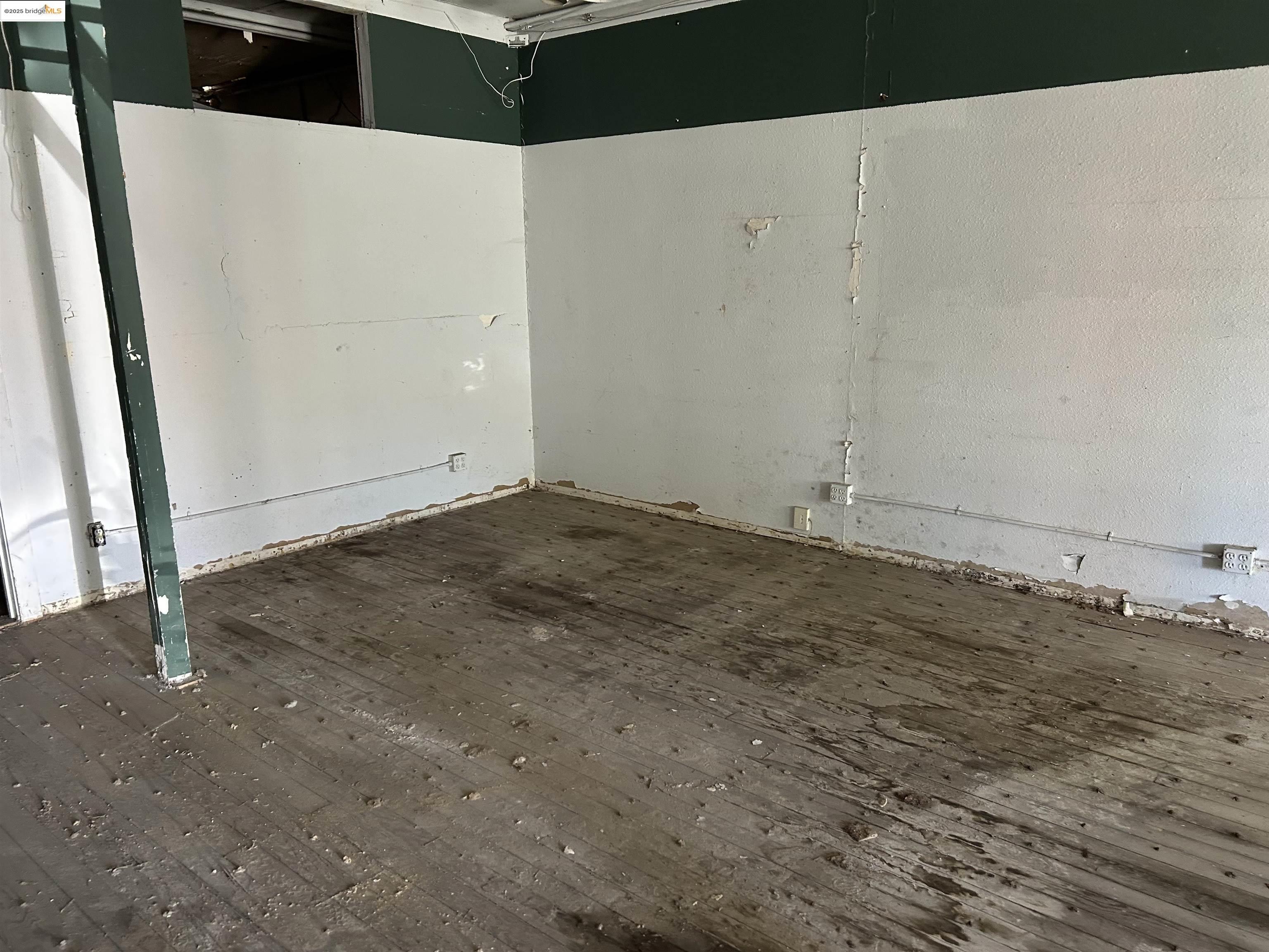 39 Main Street Isleton, CA 95641 - Photo 14 of 29 Empty room with dark wood-style flooring