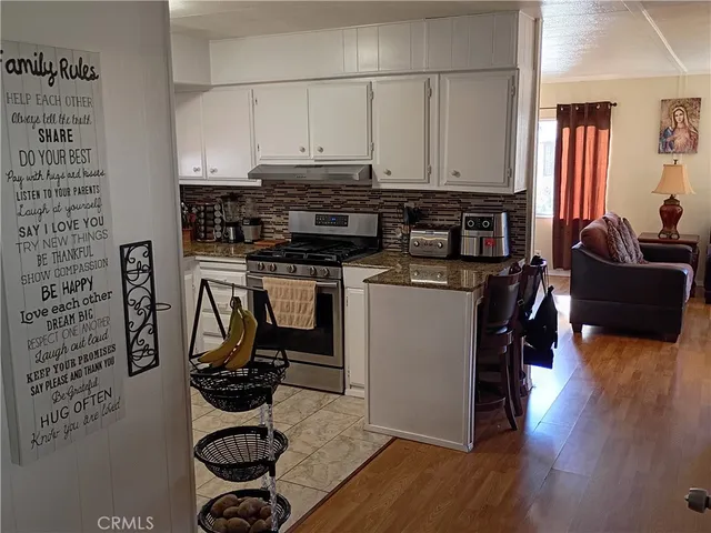 a bathroom with a sink a mirror and a window