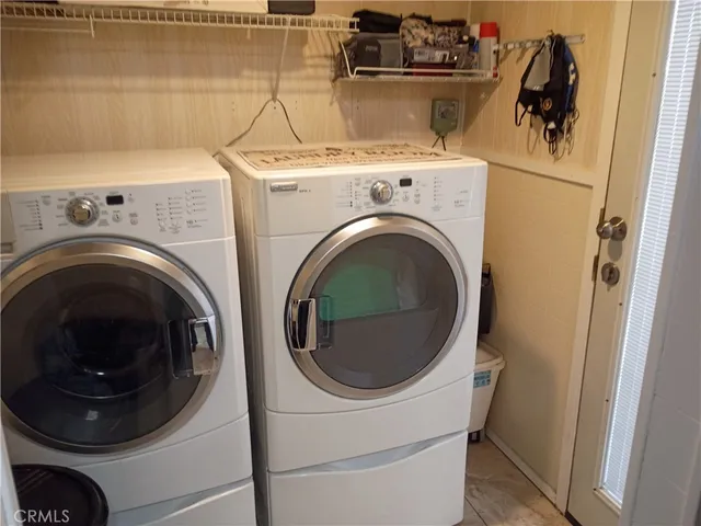 a bedroom with a bed and a flat screen television