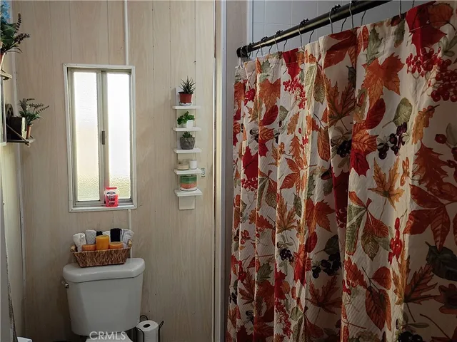 a view of a house with swimming pool and sitting area