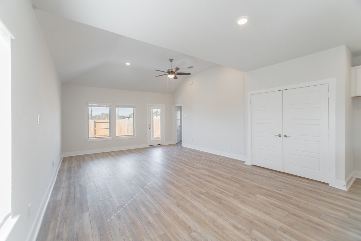 10627 Whitejacket Conroe, TX 77385 - Photo 15 of 46 wooden floor in an empty room with a window