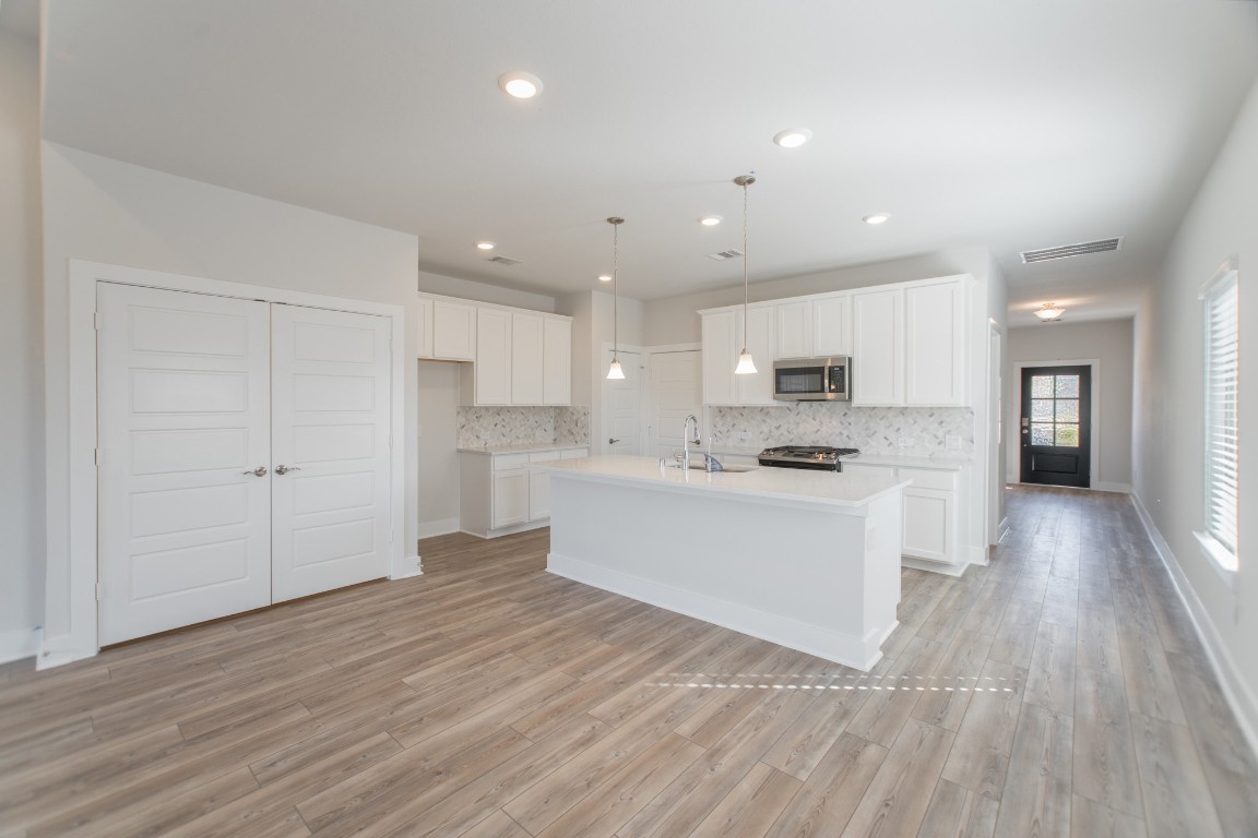 10627 Whitejacket Conroe, TX 77385 - Photo 16 of 46 a view of kitchen with wooden floor