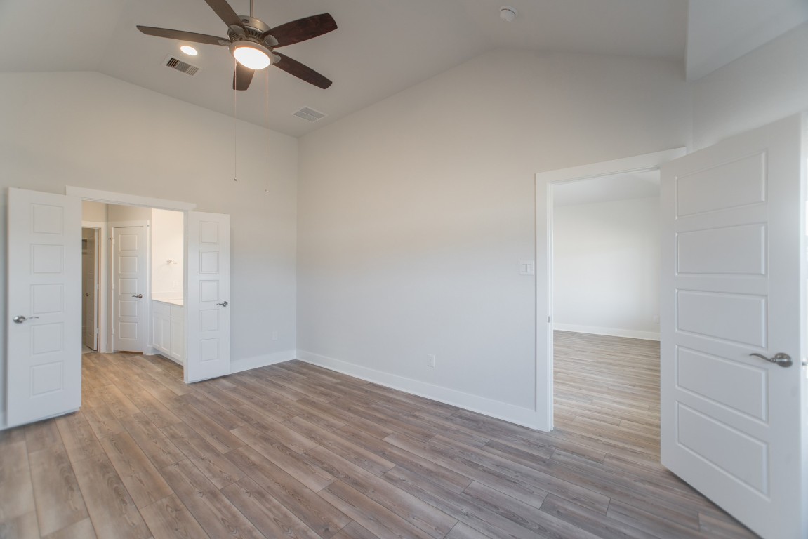 10627 Whitejacket Conroe, TX 77385 - Photo 25 of 46 a view of an empty room and wooden floor