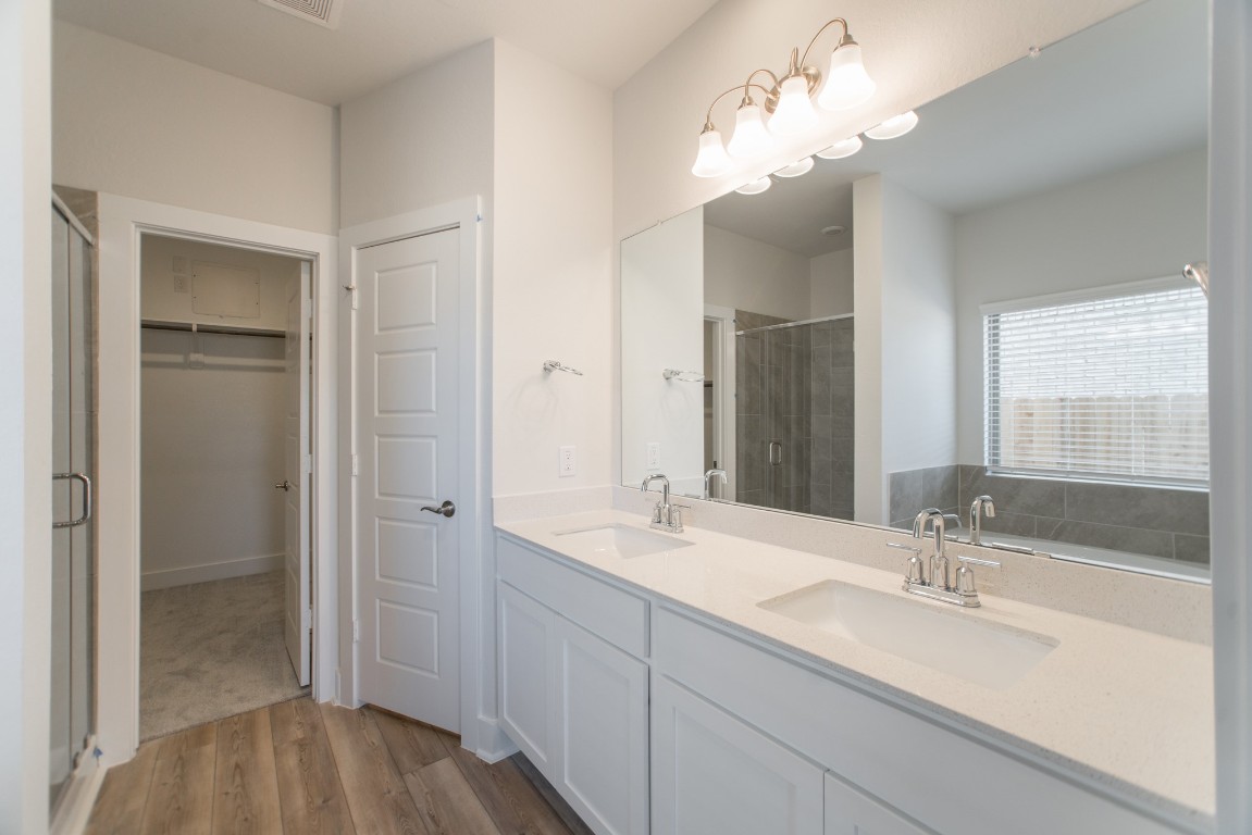 10627 Whitejacket Conroe, TX 77385 - Photo 26 of 46 a bathroom with a sink double vanity and a mirror