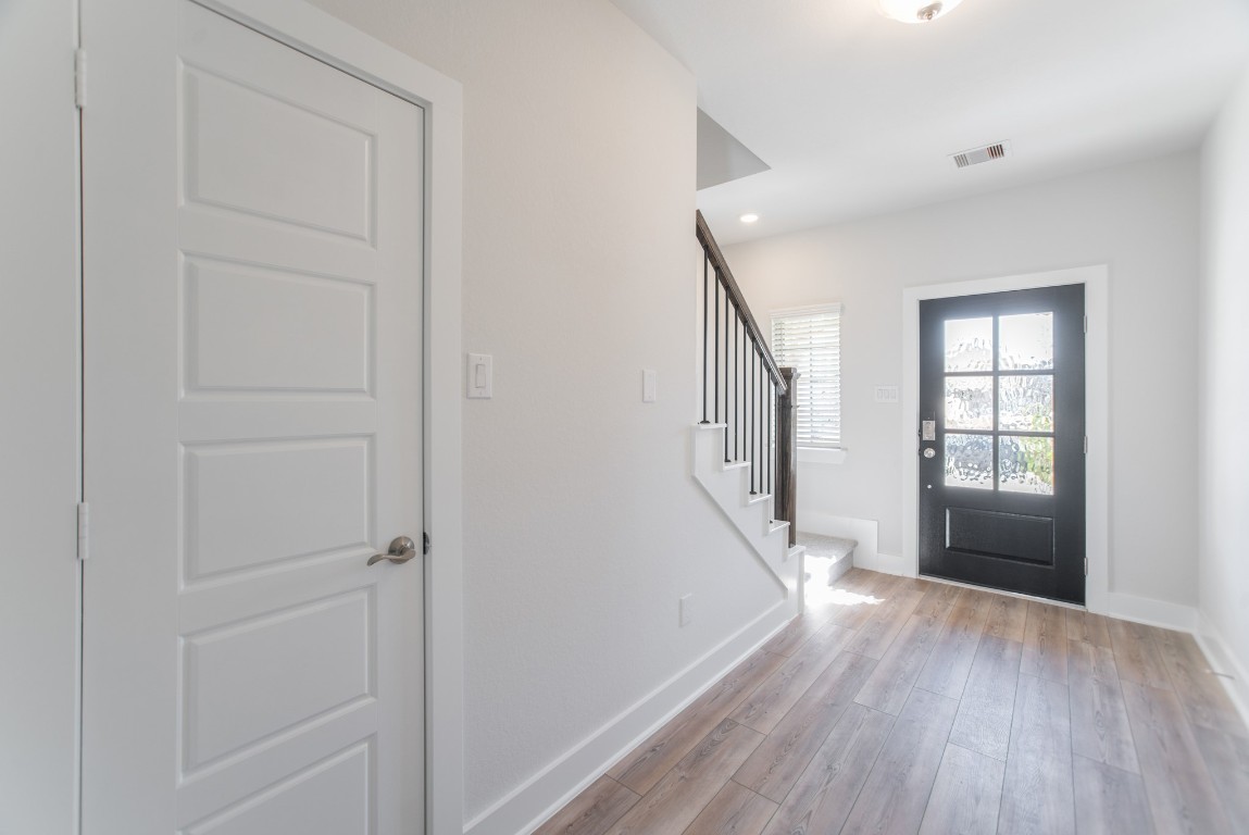 10627 Whitejacket Conroe, TX 77385 - Photo 32 of 46 wooden floor in an empty room with a window
