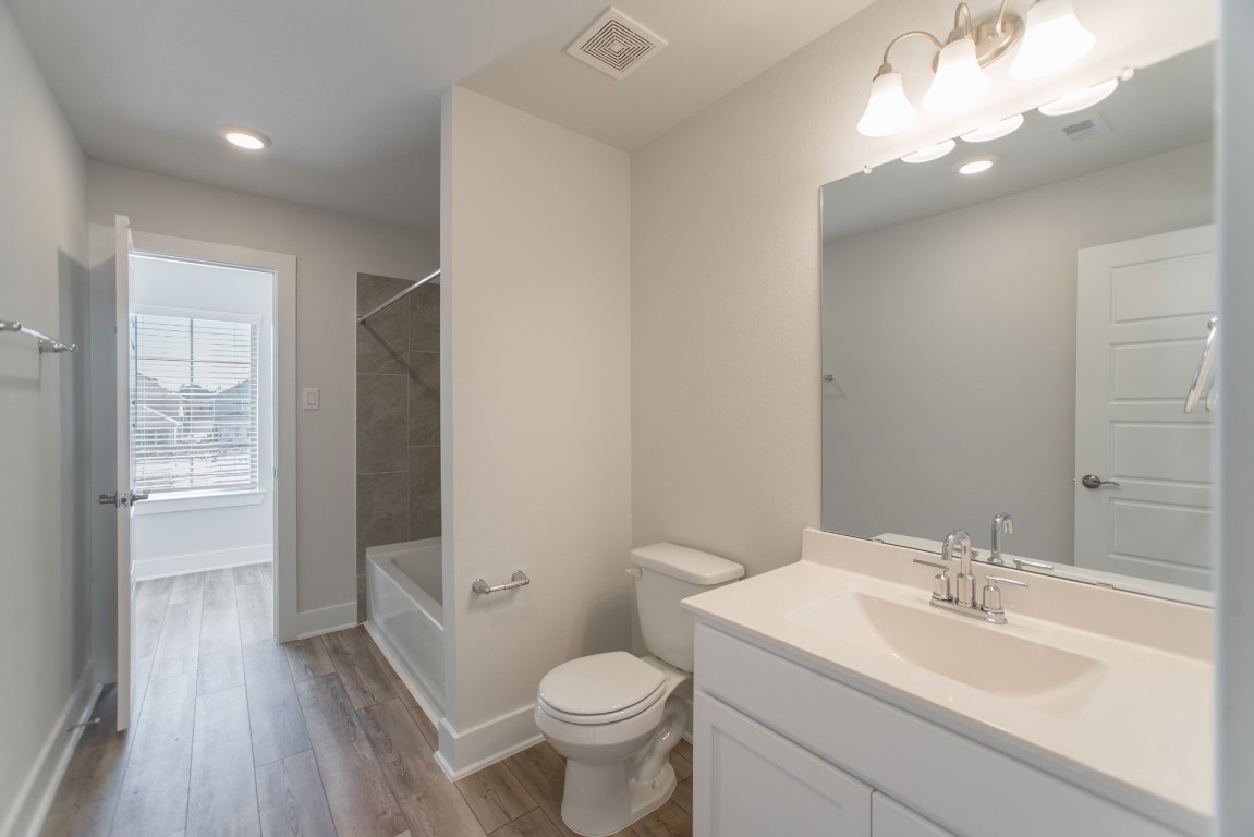 10627 Whitejacket Conroe, TX 77385 - Photo 38 of 46 a bathroom with a sink toilet and shower