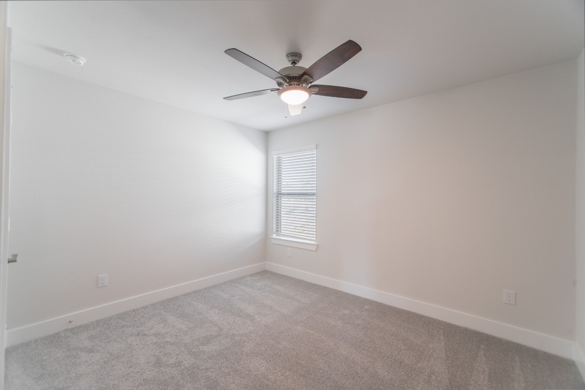 10627 Whitejacket Conroe, TX 77385 - Photo 39 of 46 a view of a livingroom with a ceiling fan and window