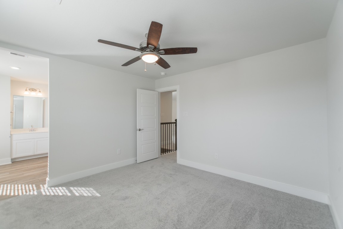 10627 Whitejacket Conroe, TX 77385 - Photo 42 of 46 a view of an empty room and chandelier fan