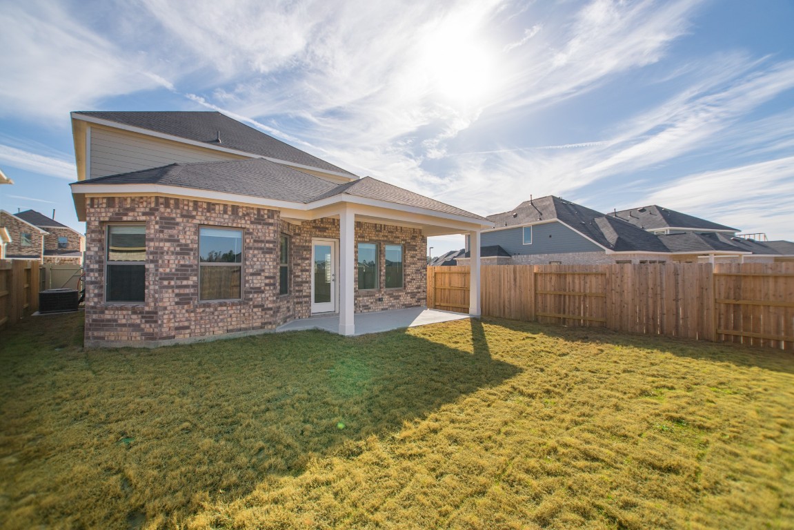 10627 Whitejacket Conroe, TX 77385 - Photo 46 of 46 a view of a house with a yard