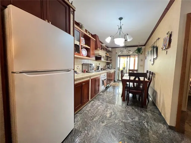 a view of a kitchen and dining room