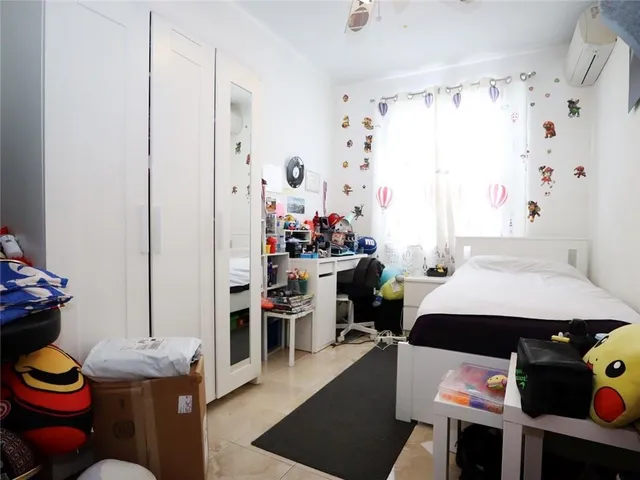 a room with furniture a rug and a closet