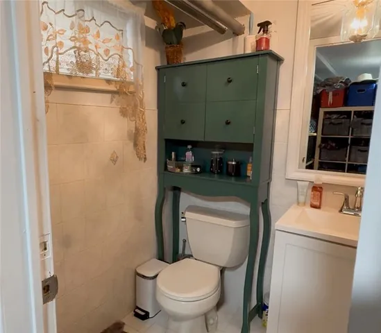 a bathroom with a toilet a sink and a shower