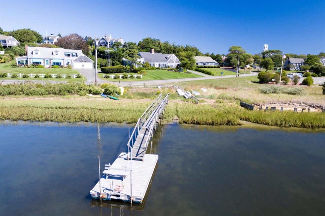 12 Pond Street Chatham, MA 02633 - Photo 1 of 16 a view of a swimming pool with some potted plants