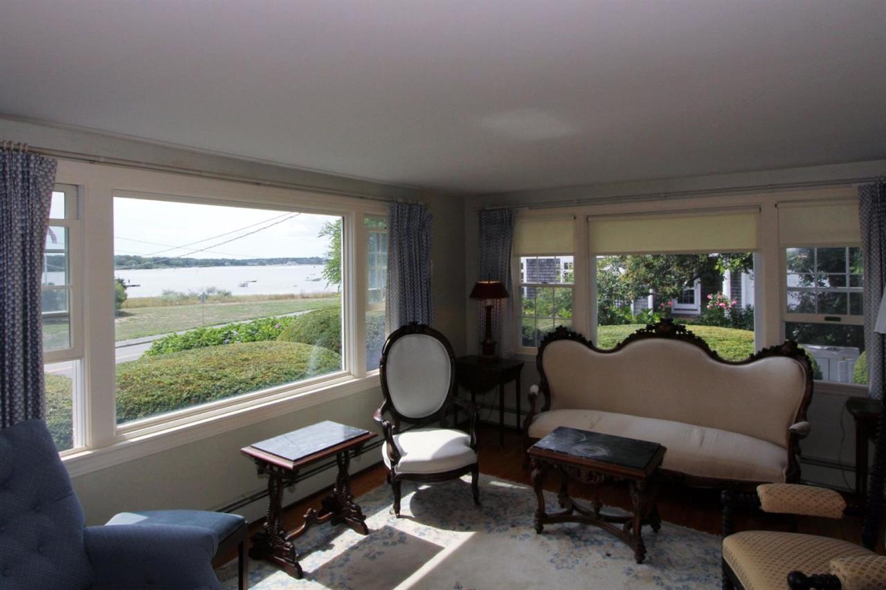 12 Pond Street Chatham, MA 02633 - Photo 6 of 16 a living room with furniture and a large window