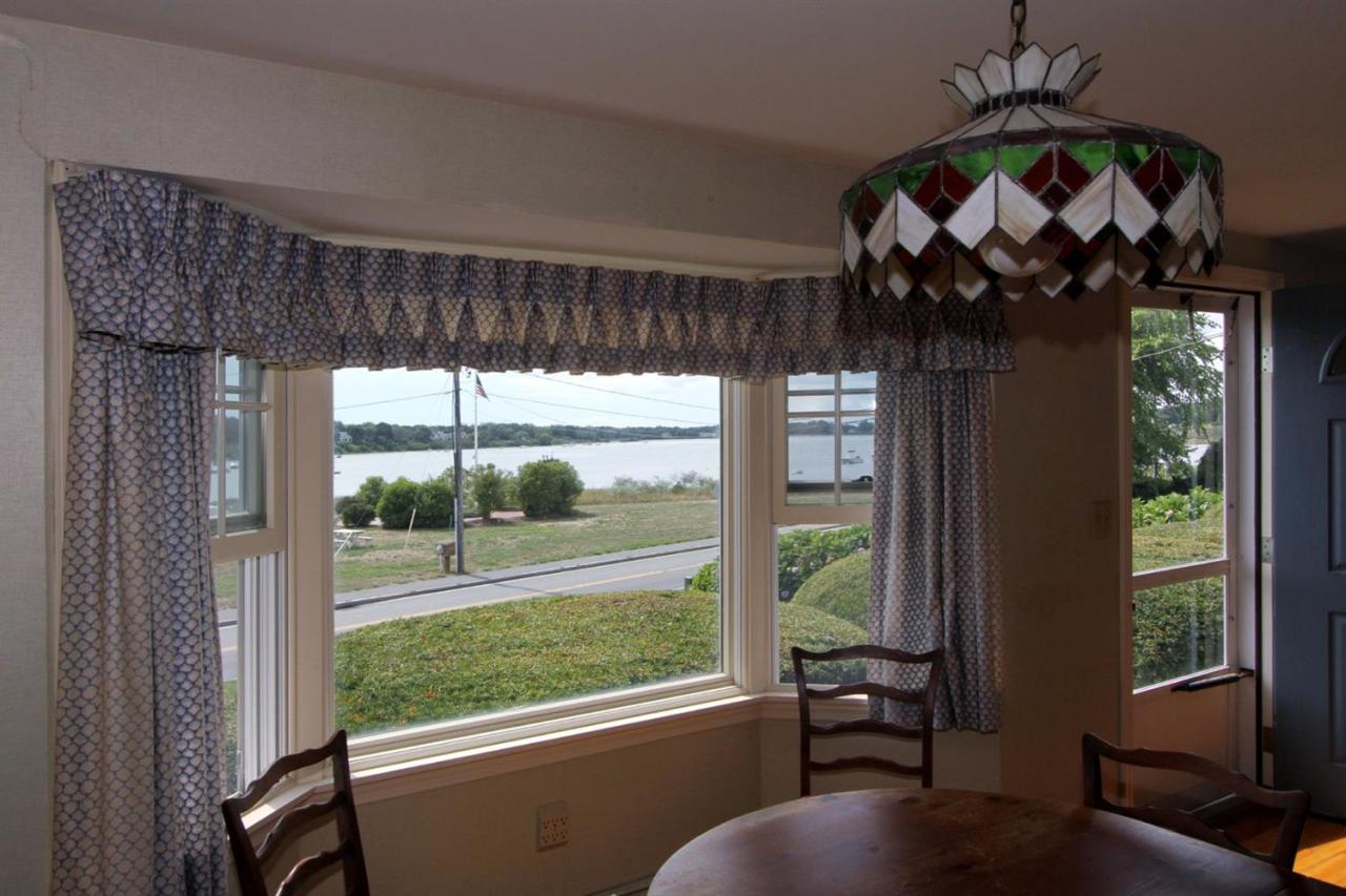 12 Pond Street Chatham, MA 02633 - Photo 8 of 16 a view of a porch with furniture and floor to ceiling window