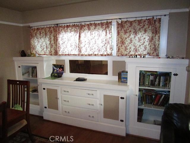 129 North Parker Street Orange, CA 92868 - Photo 12 of 17 a kitchen with a stove and a bookshelf