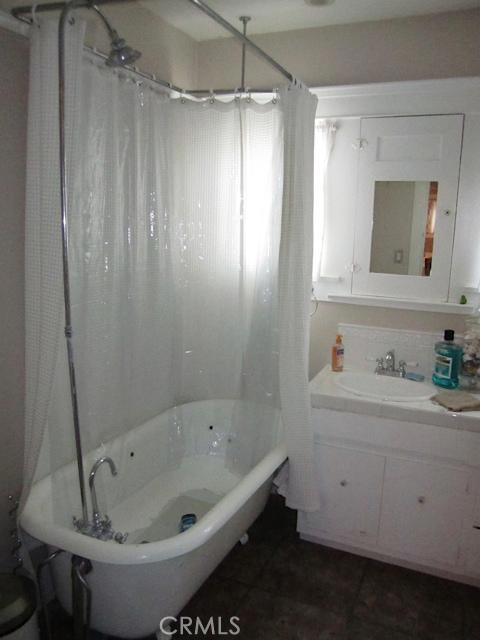 129 North Parker Street Orange, CA 92868 - Photo 14 of 17 a bathroom with a sink and a mirror