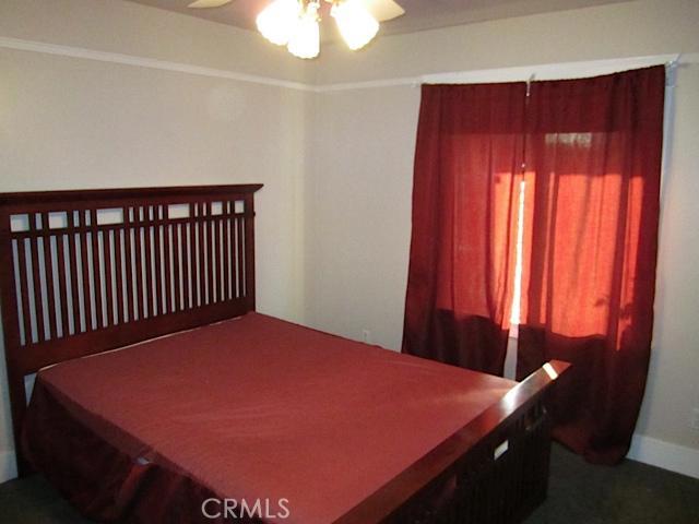 129 North Parker Street Orange, CA 92868 - Photo 15 of 17 a bed sitting in a bedroom next to a window