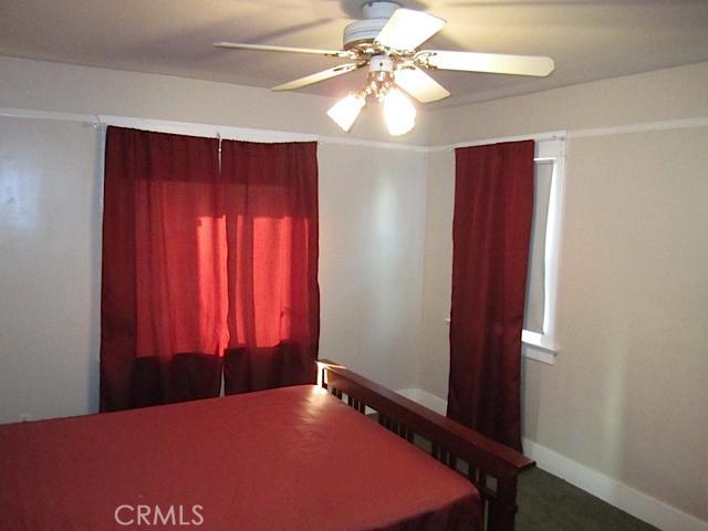 129 North Parker Street Orange, CA 92868 - Photo 17 of 17 a bedroom with a bed and a chandelier