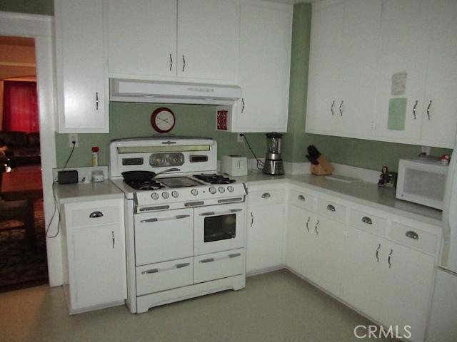 129 North Parker Street Orange, CA 92868 - Photo 9 of 17 a stove top oven sitting inside of a kitchen