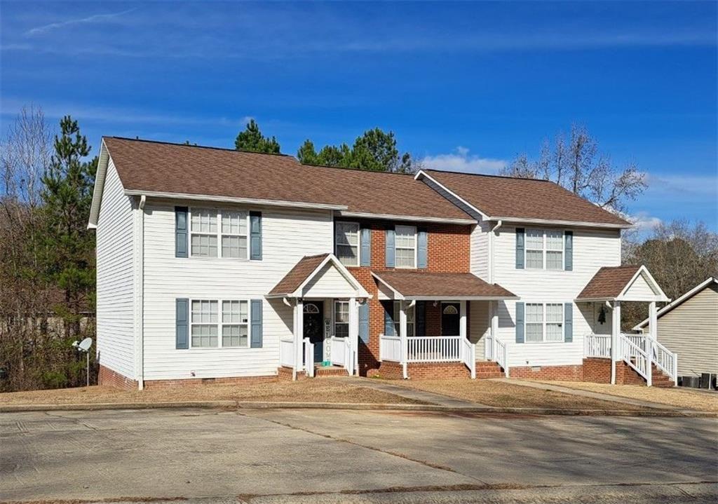1830 North Ridge Drive, Unit A Milledgeville, GA 31061 - Photo 1 of 1 a front view of a house with a yard