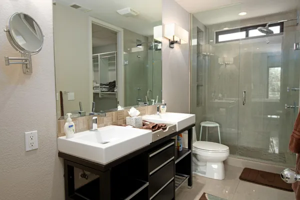 a bathroom with a shower and a sink