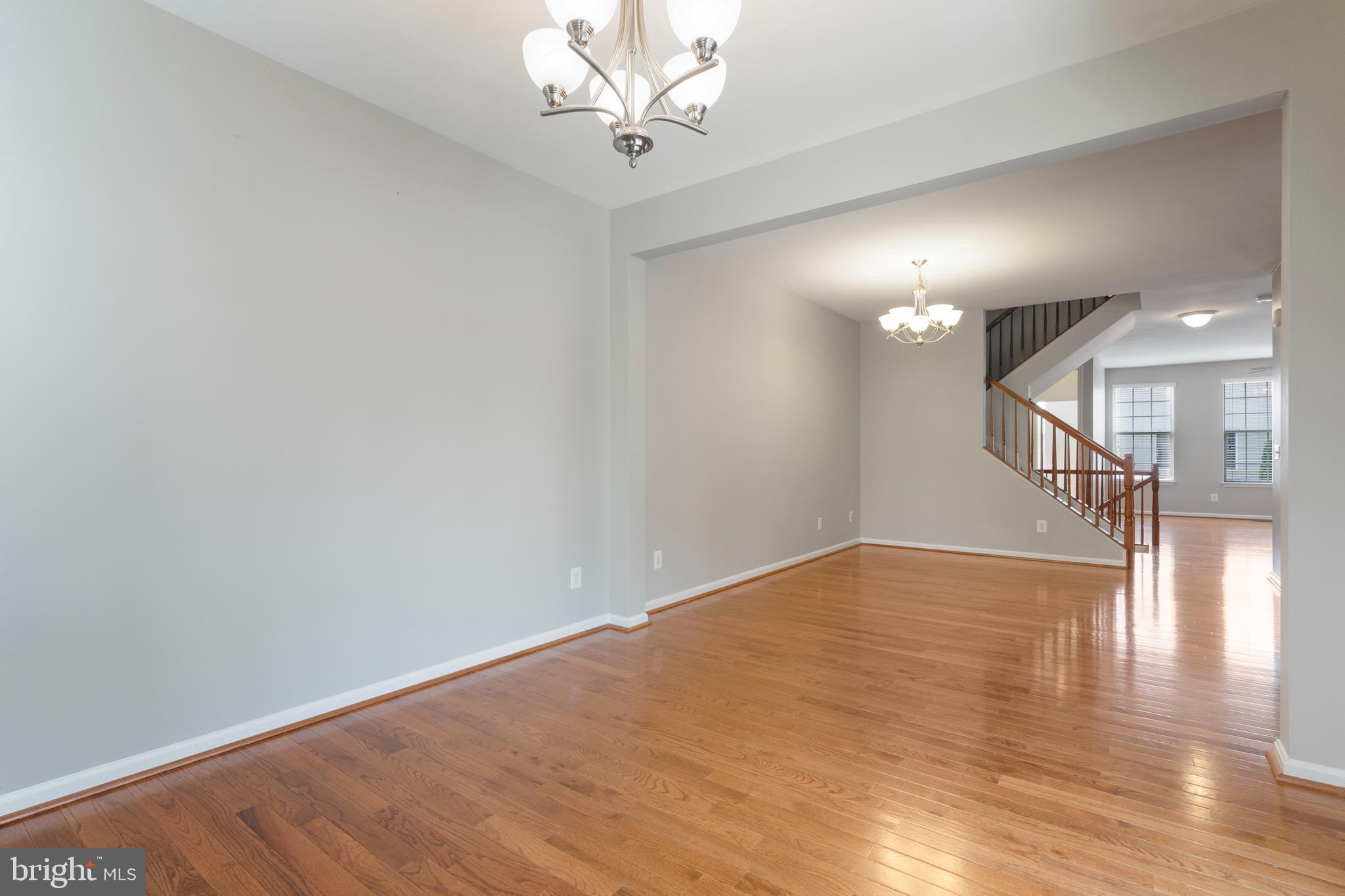 22672 Flowing Spring Square Brambleton, VA 20148 - Photo 13 of 35 a view of a room with wooden floor